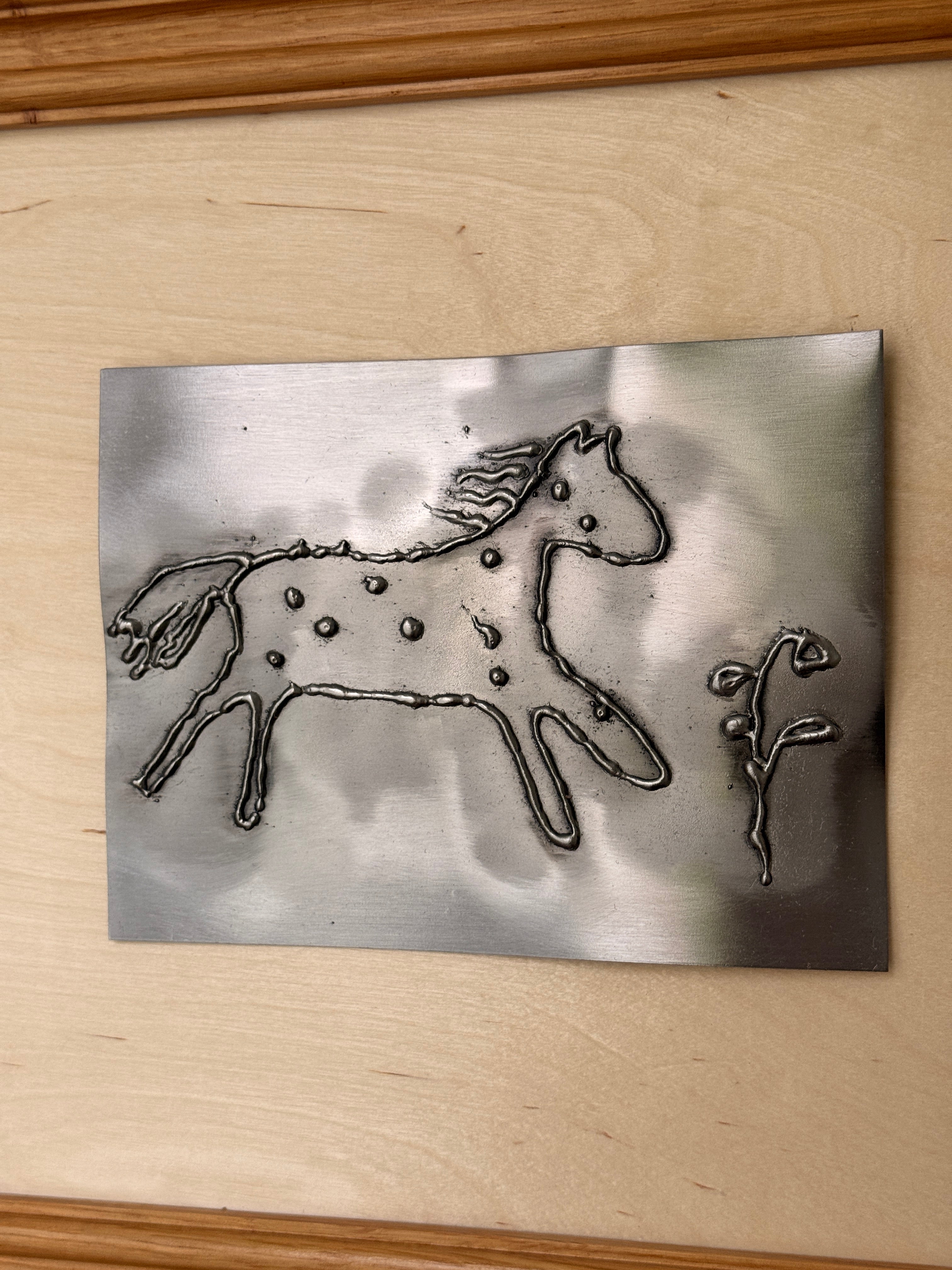 little horse on flower field artwork